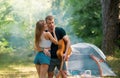 Loving young sexy coupl near camp tent. Camping couple in love. Couples of lovers tourists relax on nature. Camping trip Royalty Free Stock Photo