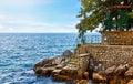 Lovran, Croatia. Rocky stone coastline with big Royalty Free Stock Photo