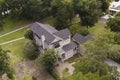 Low aerial view of beautiful residential home on large property