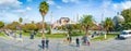 Low aerial view of Sultanahmet district in Istanbul, Turkey. Locals and tourists walk along square, green grass field and fountain Royalty Free Stock Photo