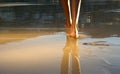 Low angle african american woman walking on beach Royalty Free Stock Photo