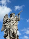 Low angle of an angelic figure against a cloudy blue sky at Castel Sant'Angelo in Rome, Italy Royalty Free Stock Photo