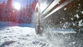 LOW ANGLE: Bright sun rays shine on car struggling to gain traction in snow. Royalty Free Stock Photo