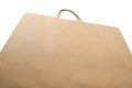 Low angle of brown recycle shopping bag with handles on white ba