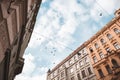 Low angle of buildings with birds flying high above Royalty Free Stock Photo