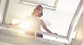 Low angle, businesswoman and portrait for confidence by stairs, office and professional by railing. Female person, happy