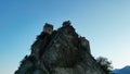 Low angle of the cliff that holds the medieval castle of Roccascalegna in southern Italy