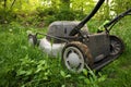 Low Angle Close up lawnmower ready to be cutting long grass or illustrating concept of helping bees Royalty Free Stock Photo