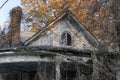 Low angle closeup shot of an abandoned overgrown house in the midwest Royalty Free Stock Photo