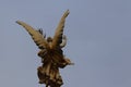 Low angle closeup shot of an angel statue under a clear blue sky Royalty Free Stock Photo