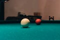 Low angle closeup shot of the white and the number three billiard balls on a table Royalty Free Stock Photo