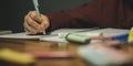 Low angle closeup view of a child making homework