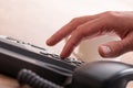 Male finger dialing a telephone number Royalty Free Stock Photo