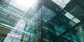 Low angle closeup view of modern green glass facade office building Royalty Free Stock Photo