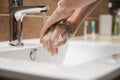 Low angle closeup view of woman washing her hands