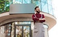 Proud owner of coffee shop standing next to empty sign Royalty Free Stock Photo