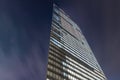 Low angle of the Dentsu building at night in the Shiodome area of Minato, Tokyo, Japan