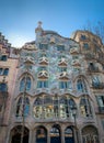 Low angle dramatic view of the Casa Batllo facade known as the house of bones designed by Antoni Gaudi. Royalty Free Stock Photo