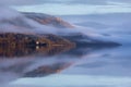 Low-angle of Dunderave castle on the foogy shores of the picturesque Loch Fyne, Scotland