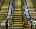 Low-angle of an escalator view with yellow stairs and three lines