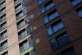 Low angle and exterior street view of typical building, housing or apartment in Europe with brick tile facade. Royalty Free Stock Photo