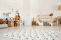 Low angle of a girl`s bedroom interior with a patterned rug, woo