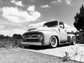Low-angle grayscale of the Ford F-150 vintage car outdoors