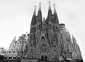 Low angle grayscale shot of the Expiatory Temple of the holy family in Barcelona, Spain