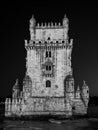 Low angle grayscale shot of Garden of Belem Tower in Lisbon Portugal at night