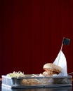 Low angle hamburger with beef burger cutlet, fried onion, ketchup sauce and french fries in traditional buns Royalty Free Stock Photo