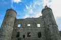 Low angle of the Harlech Castle in Wlaes with a cloudscape in the background Royalty Free Stock Photo