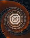 Low angle of the head-spinning spiral staircase of Vatican museum Royalty Free Stock Photo