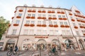 Low angle of Hirmer menswear clothing store building in Munich, Germany with cyclers in front of it Royalty Free Stock Photo