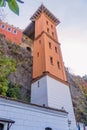 Low-angle of the historic Asansor Elevator Tower in Izmir, Turkey, with a fort structure in a stone