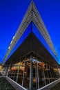 Low angle of knife edge building with blue sky