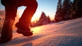 CLOSE UP: Unrecognizable woman runs up a snowy hill on a sunny winter evening.
