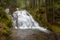 Low-angle of Lower Soda Creek falls with long exposure effect grass around