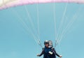 Low angle of male paraglider taking off Royalty Free Stock Photo