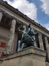 Low angle of a male riding a horse bronze sculpture at the entrance of the Altes Museum in Berlin
