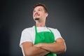 Low angle of male supermarket employer with arms crossed Royalty Free Stock Photo