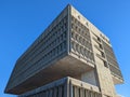 Low angle of the Marcel Breuer Building with blue sky background in New Haven