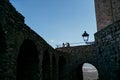 Low angle of old arch walls of a castle against the blue sky Royalty Free Stock Photo