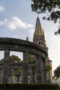 Low angle perspective of part of Rotonda de los jaliscienses ilustres with two towers of cathedral Royalty Free Stock Photo