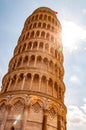 Low angle perspective view on the famous leaning Tower of Pisa or La Torre di Pisa at the Cathedral Square, Piazza del Duomo with Royalty Free Stock Photo