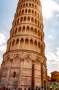 Low angle perspective view on the famous leaning Tower of Pisa or La Torre di Pisa at the Cathedral Square, Piazza del Duomo with Royalty Free Stock Photo