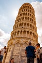 Low angle perspective view on the famous leaning Tower of Pisa or La Torre di Pisa at the Cathedral Square, Piazza del Duomo with Royalty Free Stock Photo