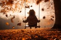 low angle photo of a kid swinging in the swing in autumn