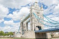 Low Angle View of the Iconic Tower Bridge Under a Cloudy Blue Sky Royalty Free Stock Photo