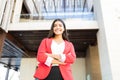 Businesswoman In Stylish Wear Smiling Outside Office Royalty Free Stock Photo