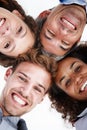 High energy business team. Low angle portrait of a group of positive-looking businesspeople standing arm in arm in a